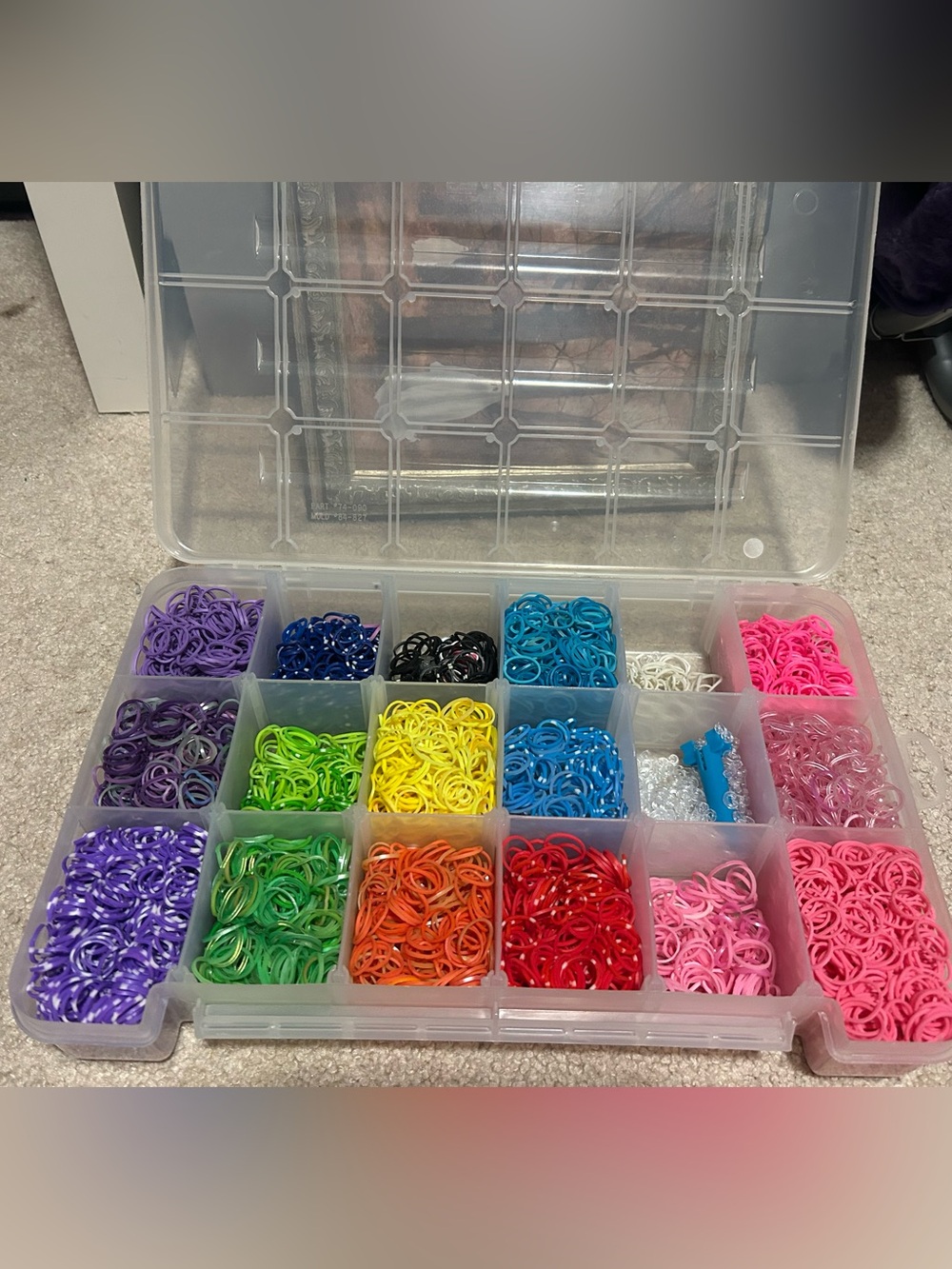 Assorted rainbow-loom Rubber Bands including a rainbow-loom craft design form.